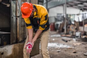 An accident occurred at a work place and a man has cut his hand.