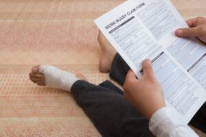 PERSON WITH CRUSH INJURY TO THEIR FOOT LOOKING AT PERSONAL INJURY CLAIM FORM