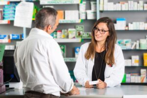 A pharmacist dispenses medication. 