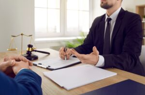 A solicitor explains what are special damages to a client while sat behind a desk. 