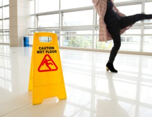 PERSON SLIPPING ON A WET FLOOR IN A PUBLIC PLACE