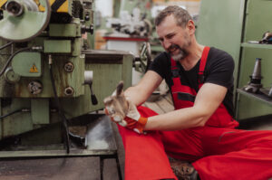 Employee who was working with a machine and injured his hand 