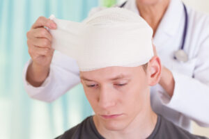 A young man being examined by a doctor for signs of an acquired brain injury