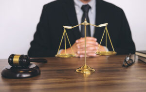 A male solicitor sitting at his desk 