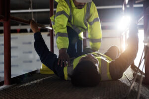 Builder who has fallen over in dull working conditions 